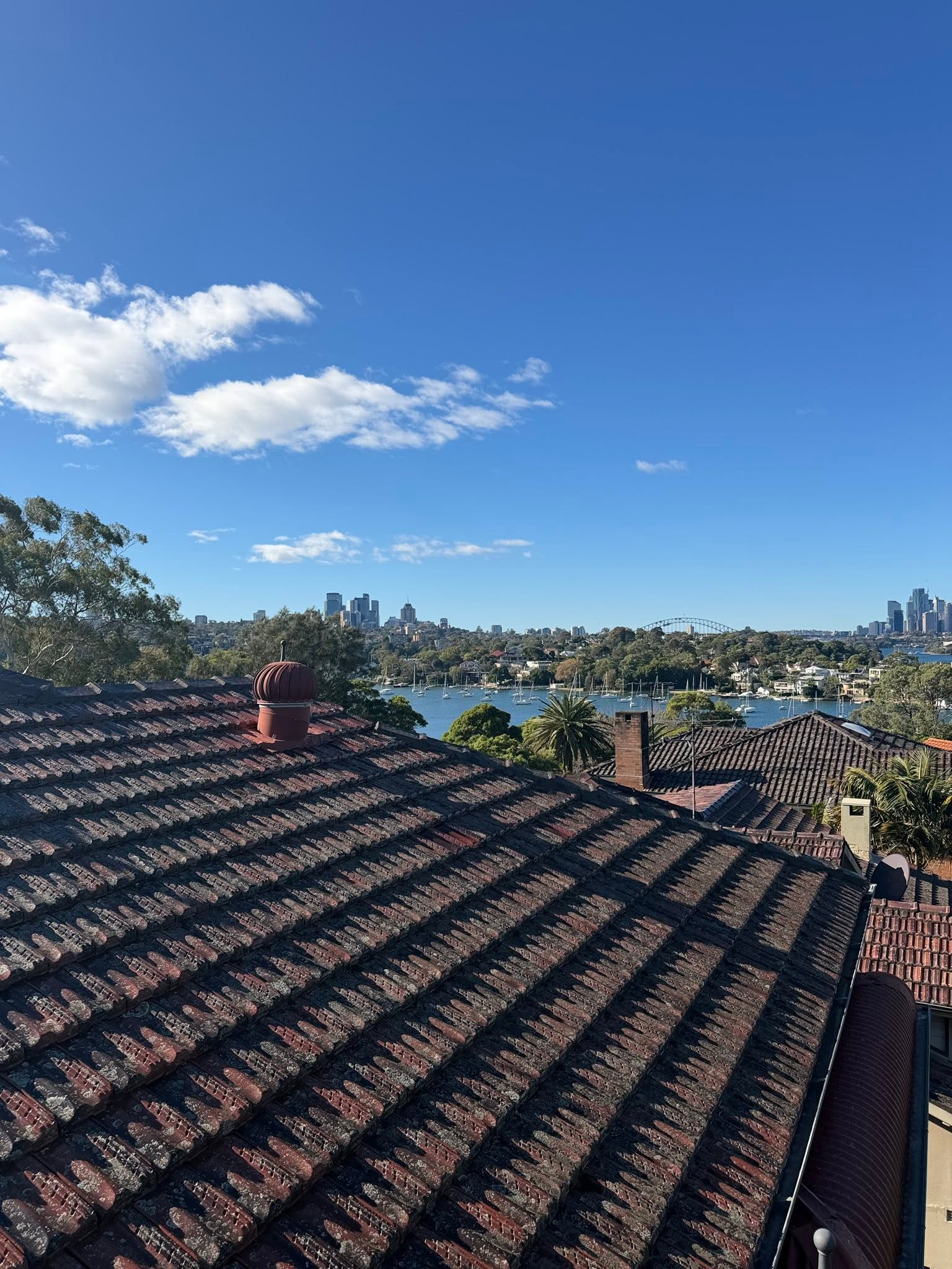 View from the Longueville tiled roof towards the harbour and city