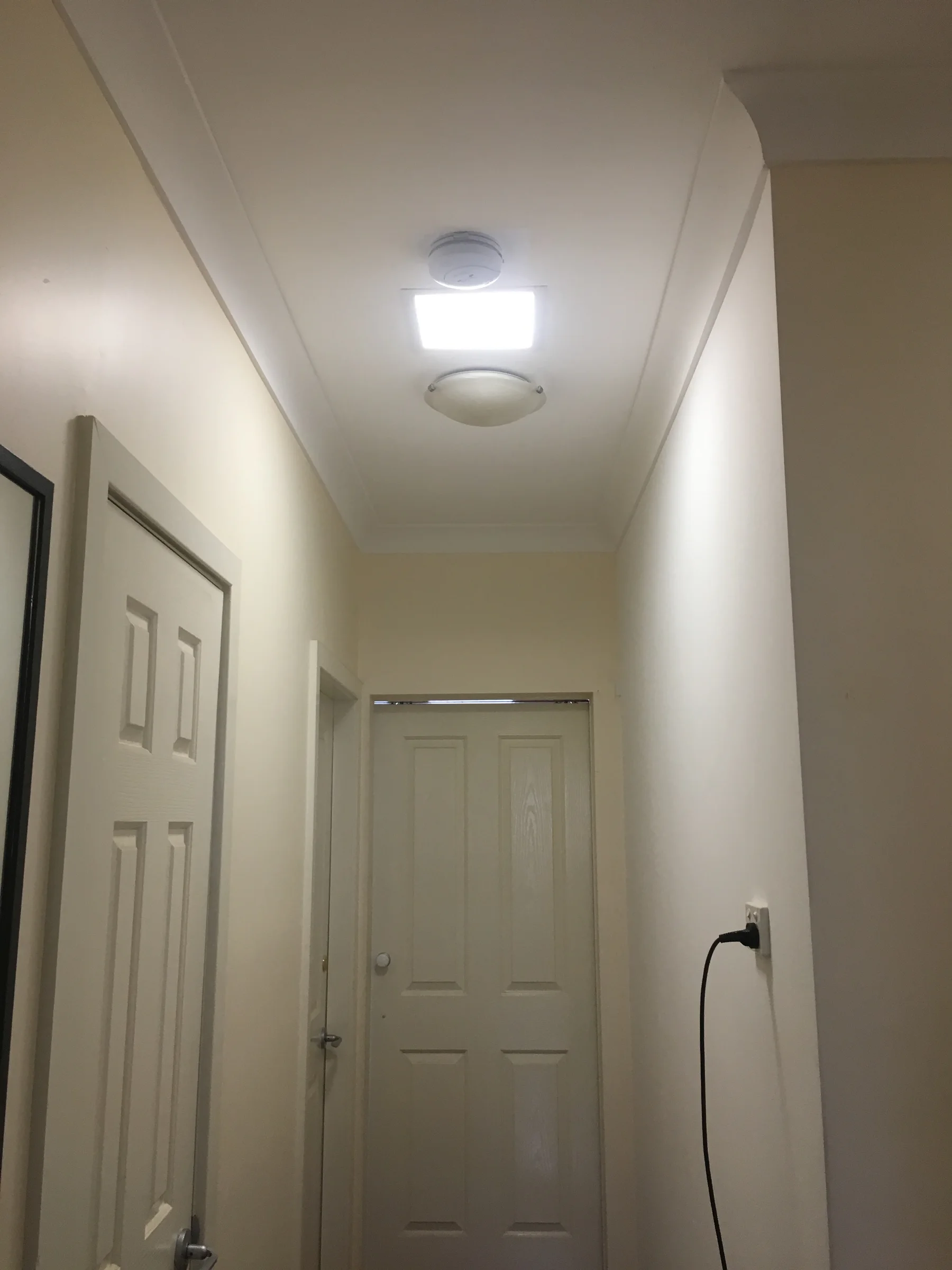 Solar-powered LED skylight alternative illuminated above a stairwell in North Strathfield